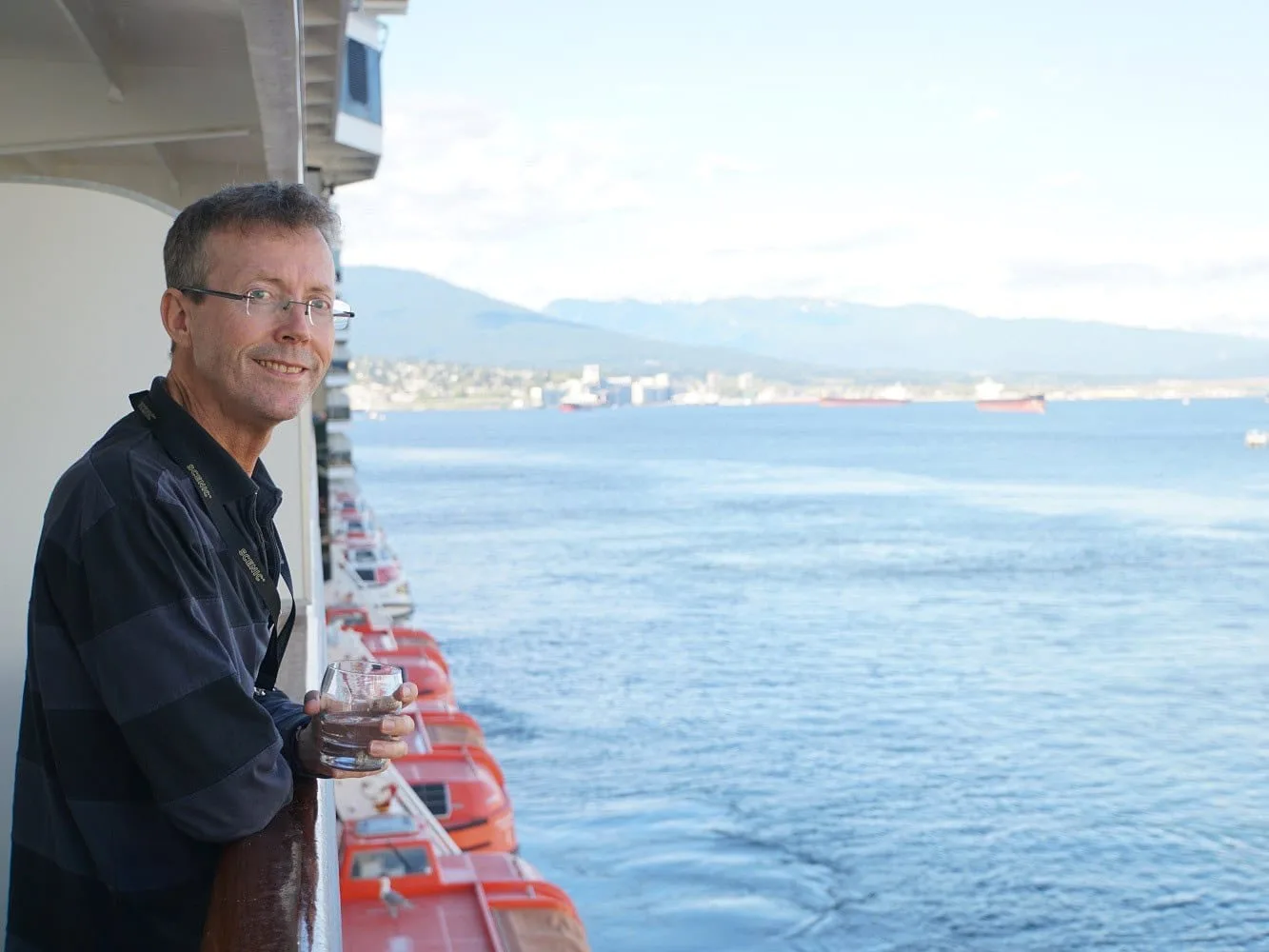 Philip Clape on MS Nieuw Amsterdam balcony - Image by Holidays Beckon